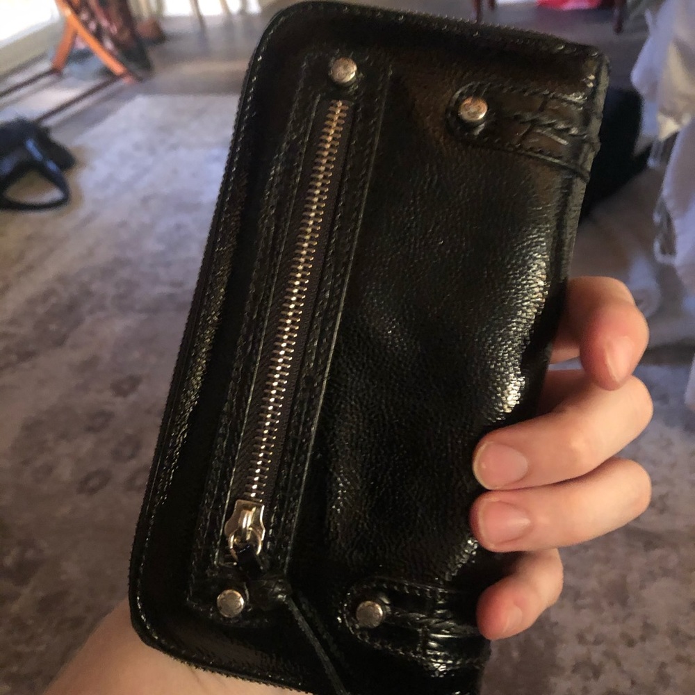 Brighten patent leather wristlet.